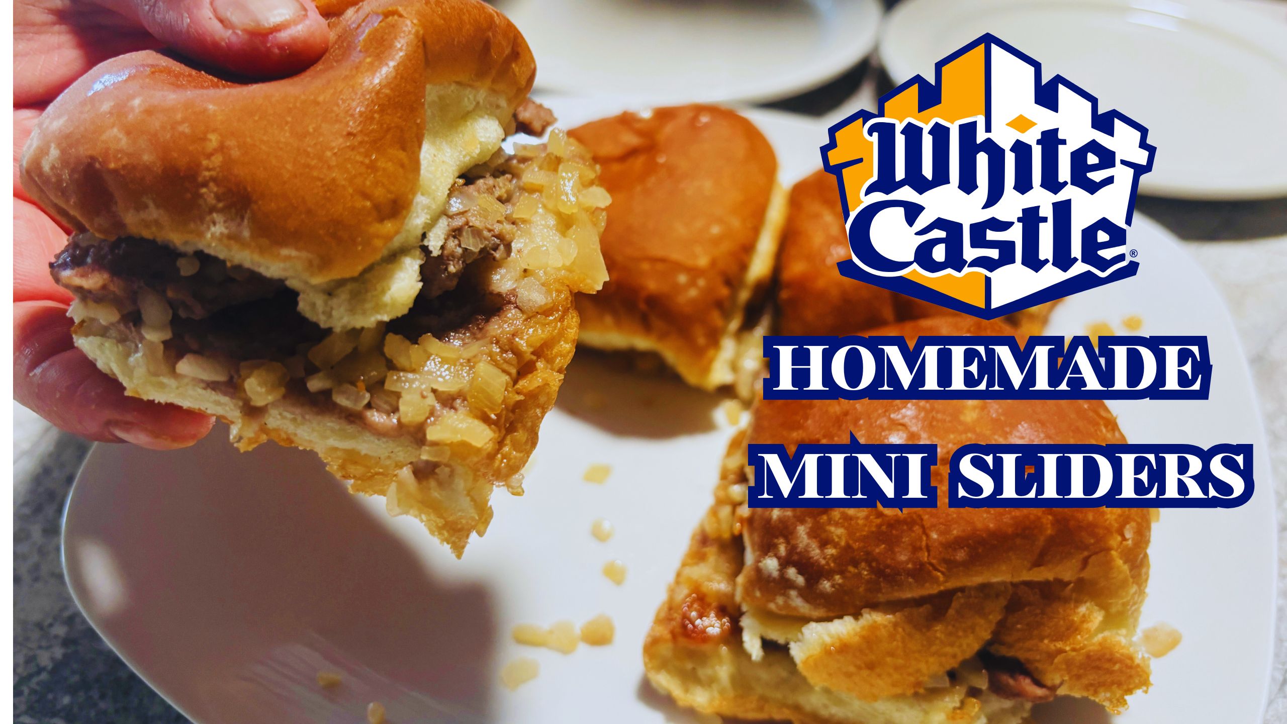 "Close-up of White Castle sliders on a tray with onions and pickles, showcasing the small square burgers in soft buns.